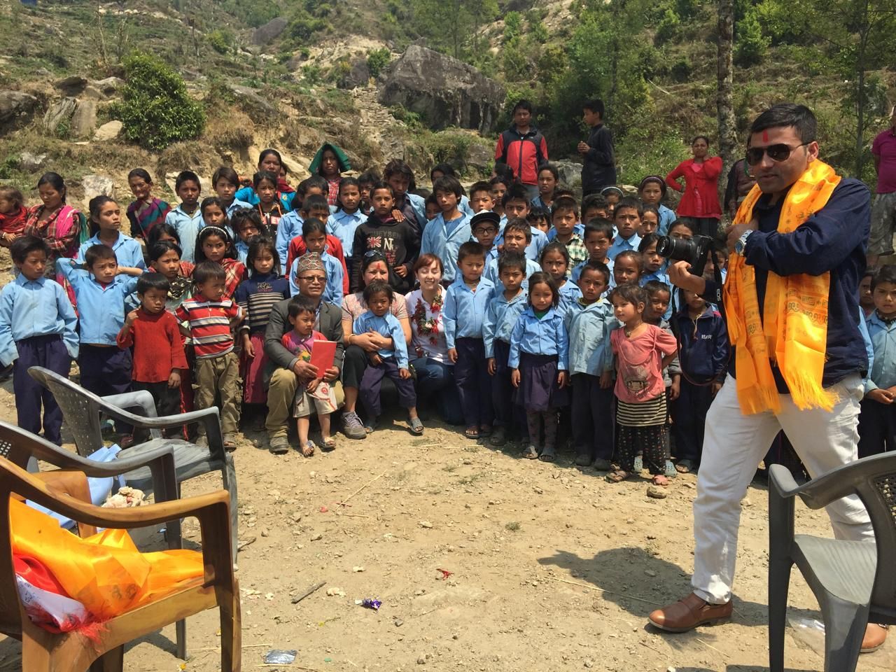 Badri Raj Timalsina with students at a school programme